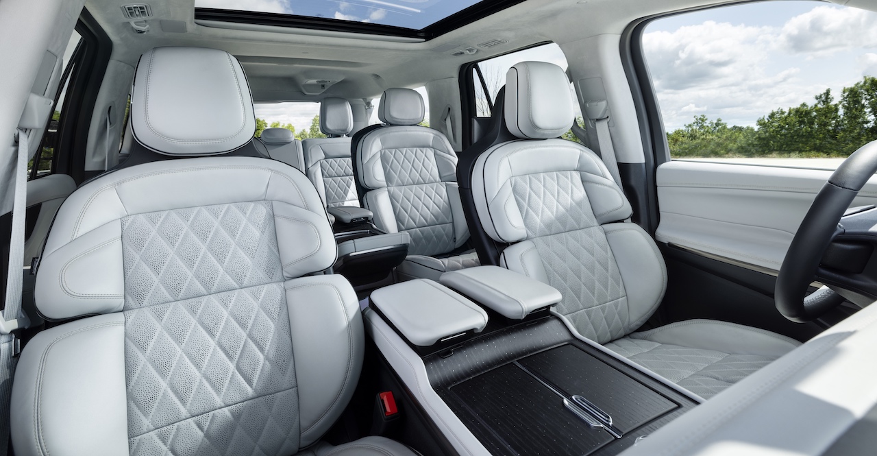 Luxurious interior of the 2026 Lincoln Navigator featuring spacious, quilted leather seats and a panoramic sunroof.