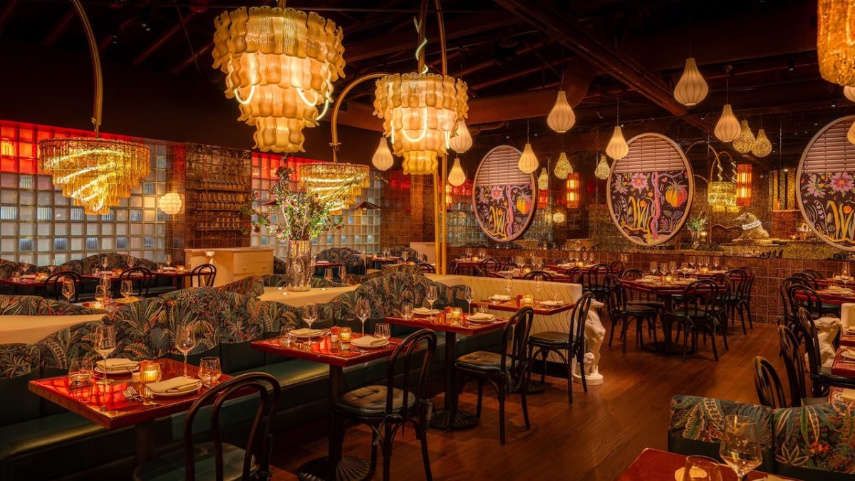Elegant interior of Bad Roman, featuring vibrant decor, stylish furnishings, and unique chandeliers in a lively dining atmosphere.