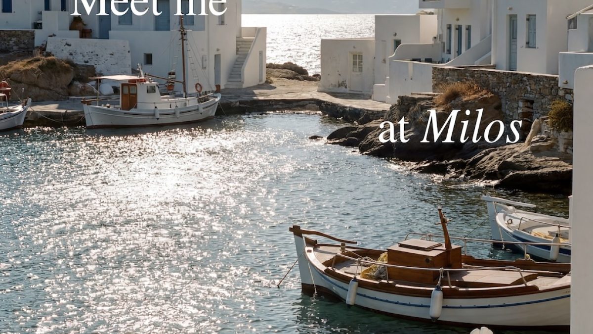 Chairs by a serene waterfront in Milos, with boats and white buildings reflecting a summer vibe.