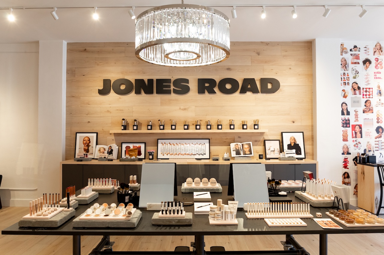 Jones Road Beauty's first West Coast boutique in Santa Monica, featuring product displays and branding elements.