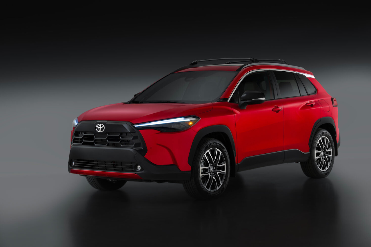 2026 Toyota Corolla Cross in red, showcasing a modern design and sporty features. Ideal compact SUV for urban driving.