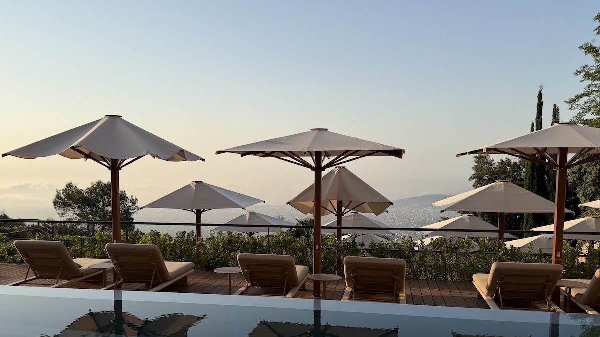 Luxurious sun loungers and umbrellas overlook the city, creating a serene escape at the METT Barcelona.