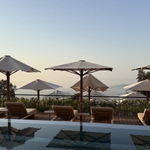 Luxurious sun loungers and umbrellas overlook the city, creating a serene escape at the METT Barcelona.