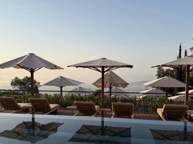 Luxurious sun loungers and umbrellas overlook the city, creating a serene escape at the METT Barcelona.