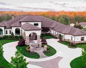 Luxury home in Hinckley featuring a spacious entrance, manicured lawns, and beautiful landscape views.