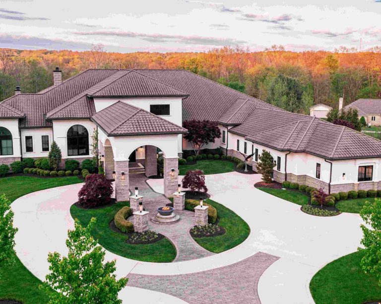 Luxury home in Hinckley featuring a spacious entrance, manicured lawns, and beautiful landscape views.