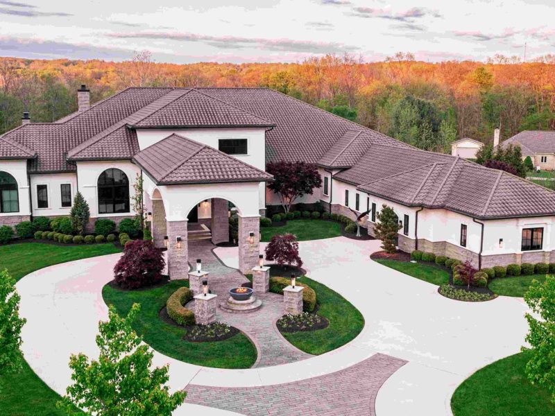 Luxury home in Hinckley featuring a spacious entrance, manicured lawns, and beautiful landscape views.
