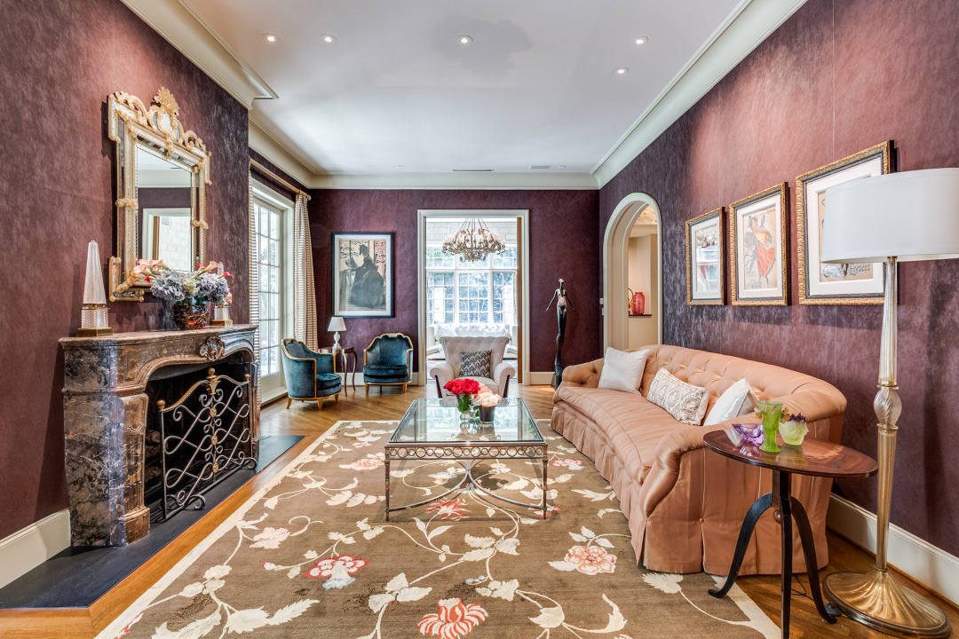 Elegantly styled living room featuring a warm color palette, plush sofa, and decorative elements in a classic setting.