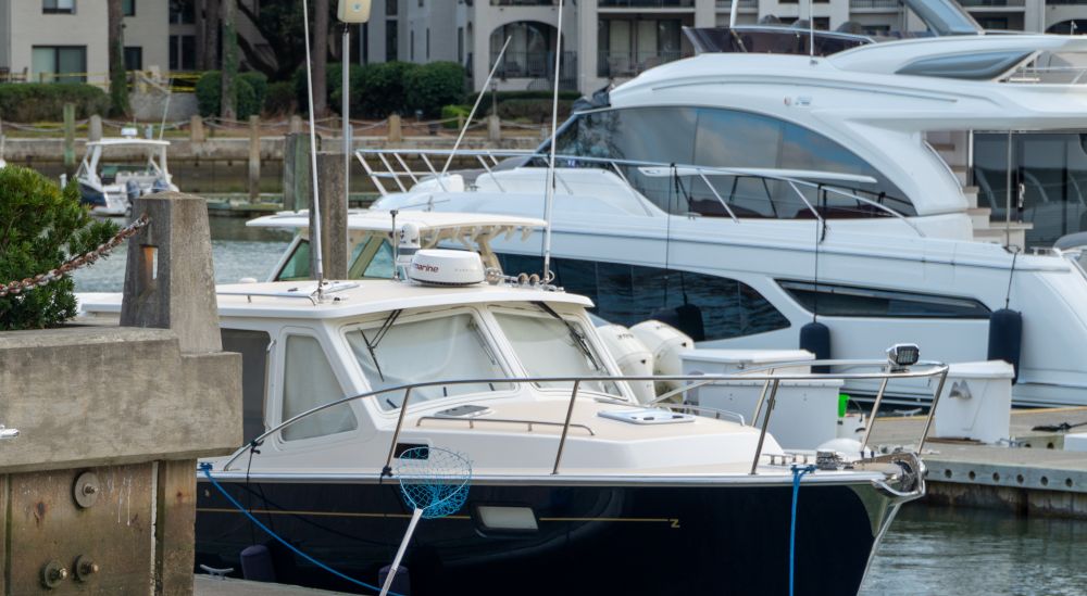 Luxury motor yachts docked at a marina, showcasing their sleek designs and high-end features for coastal cruising.