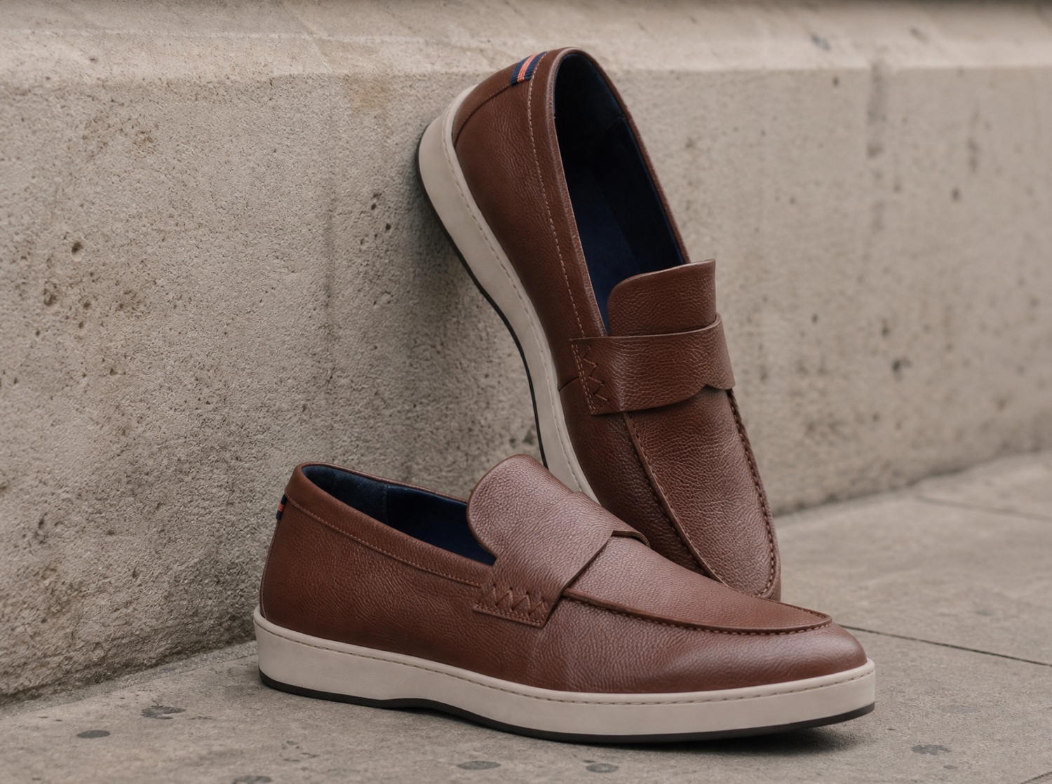 Brown slip-on shoes with a textured design, featuring a contrasting interior and a casual, stylish look for weekend wear.