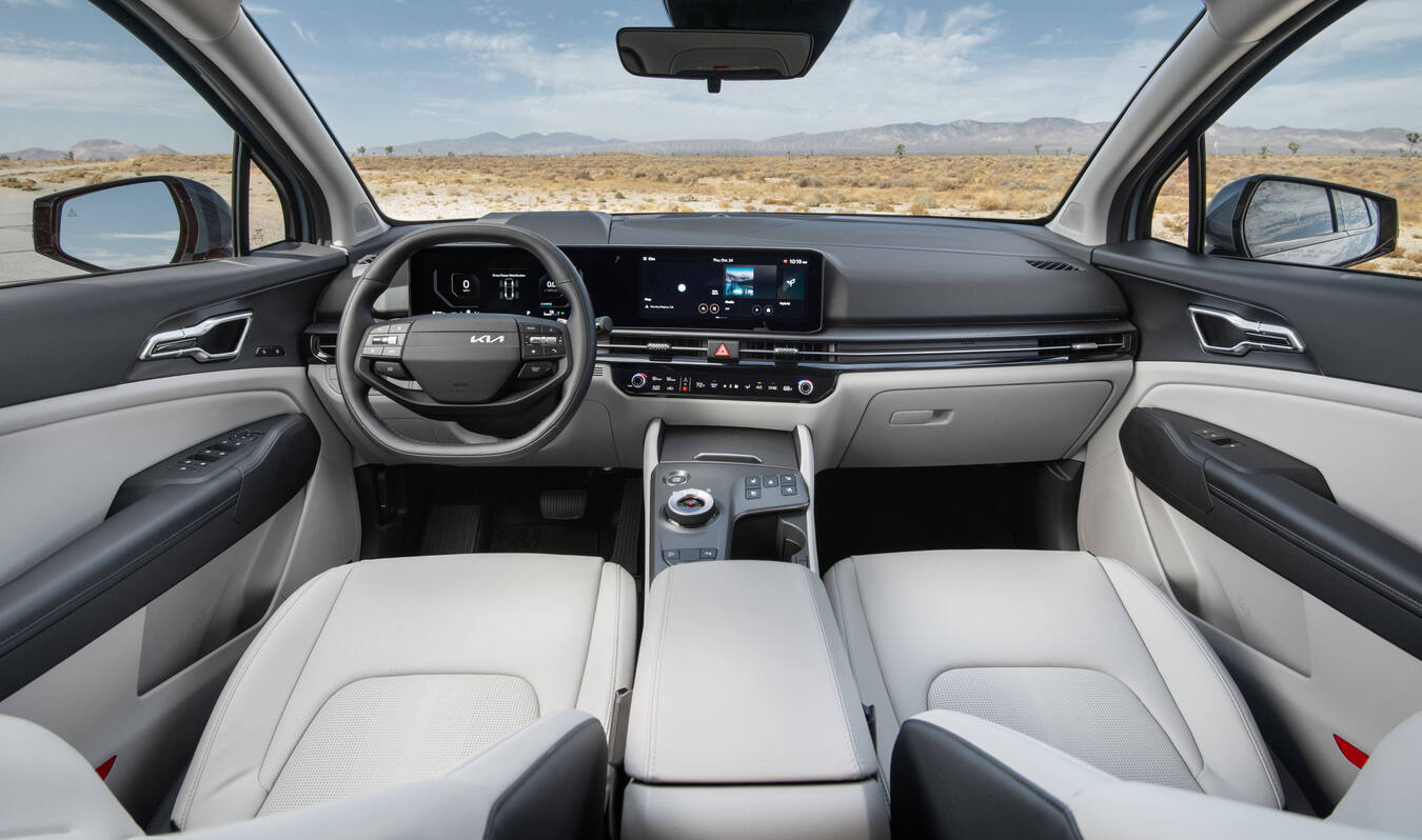 Interior view of the 2027 Kia Sportage X-Line Prestige, featuring a sleek dashboard, modern controls, and comfortable seating.