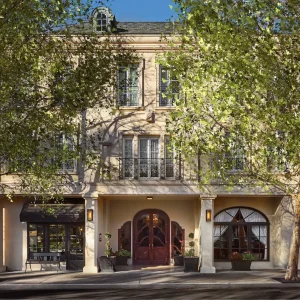 Elegant building façade of Liora Estate surrounded by trees in Healdsburg's wine country.