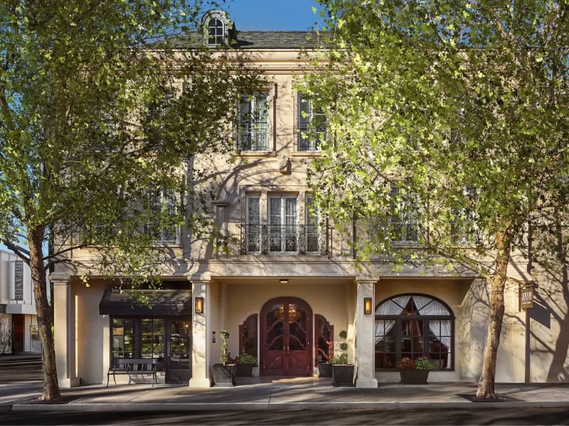Elegant building façade of Liora Estate surrounded by trees in Healdsburg's wine country.