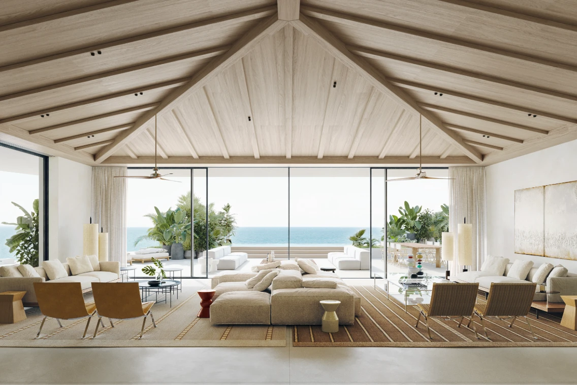 Luxurious living room with ocean views, featuring modern furniture, elegant decor, and abundant natural light.