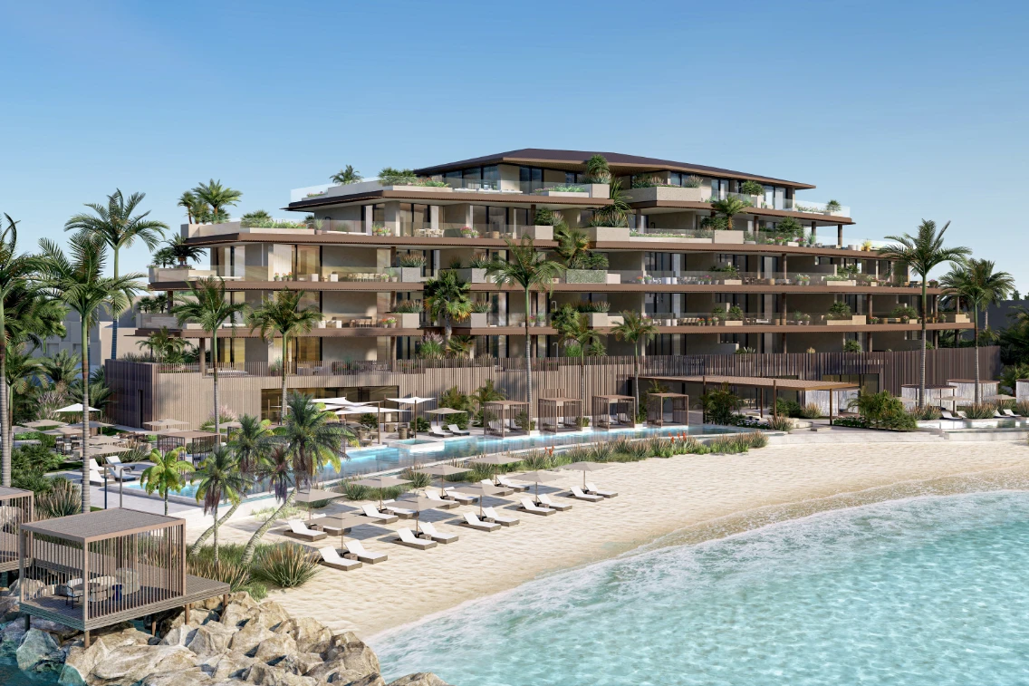 Modern beachfront luxury resort in Turks & Caicos with palm trees, lounge chairs, and a pristine swimming pool.