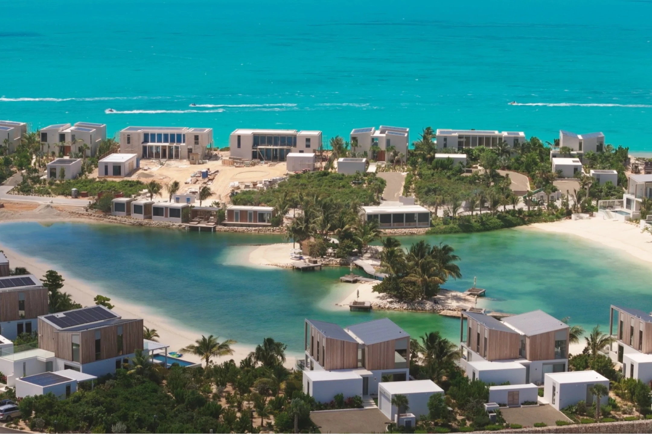 Waterfront luxury accommodations in South Bank, Turks & Caicos, with pristine waters and lush landscapes.