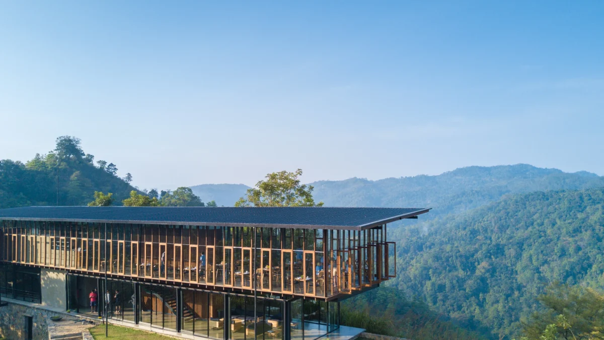 Modern pavilion at Santani Wellness Retreat overlooking lush mountains in Kandy, Sri Lanka, promoting healing and relaxation.