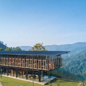 Modern pavilion at Santani Wellness Retreat overlooking lush mountains in Kandy, Sri Lanka, promoting healing and relaxation.