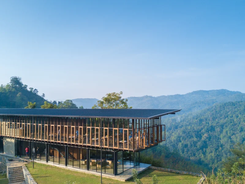 Modern pavilion at Santani Wellness Retreat overlooking lush mountains in Kandy, Sri Lanka, promoting healing and relaxation.