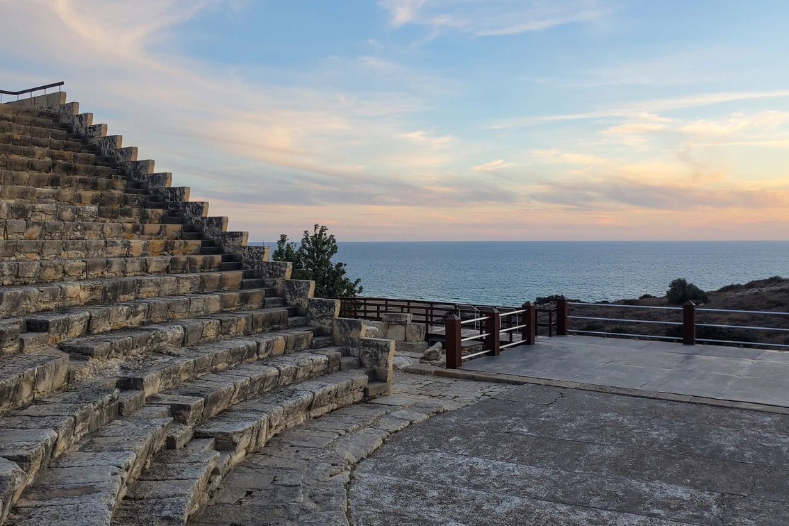 View of the ancient amphitheater steps overlooking the sea at sunset near the AMARA Hotel, Cyprus.
