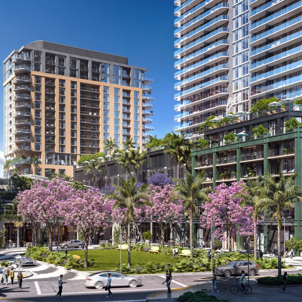 A vibrant street view of Midtown Miami featuring luxury buildings, blooming trees, and pedestrians enjoying the urban landscape.