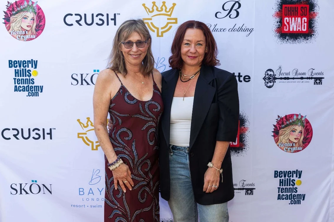 Two women pose together at the DRAFT 2026 Celebrity Prime Time Emmy Nominees event, surrounded by promotional banners.