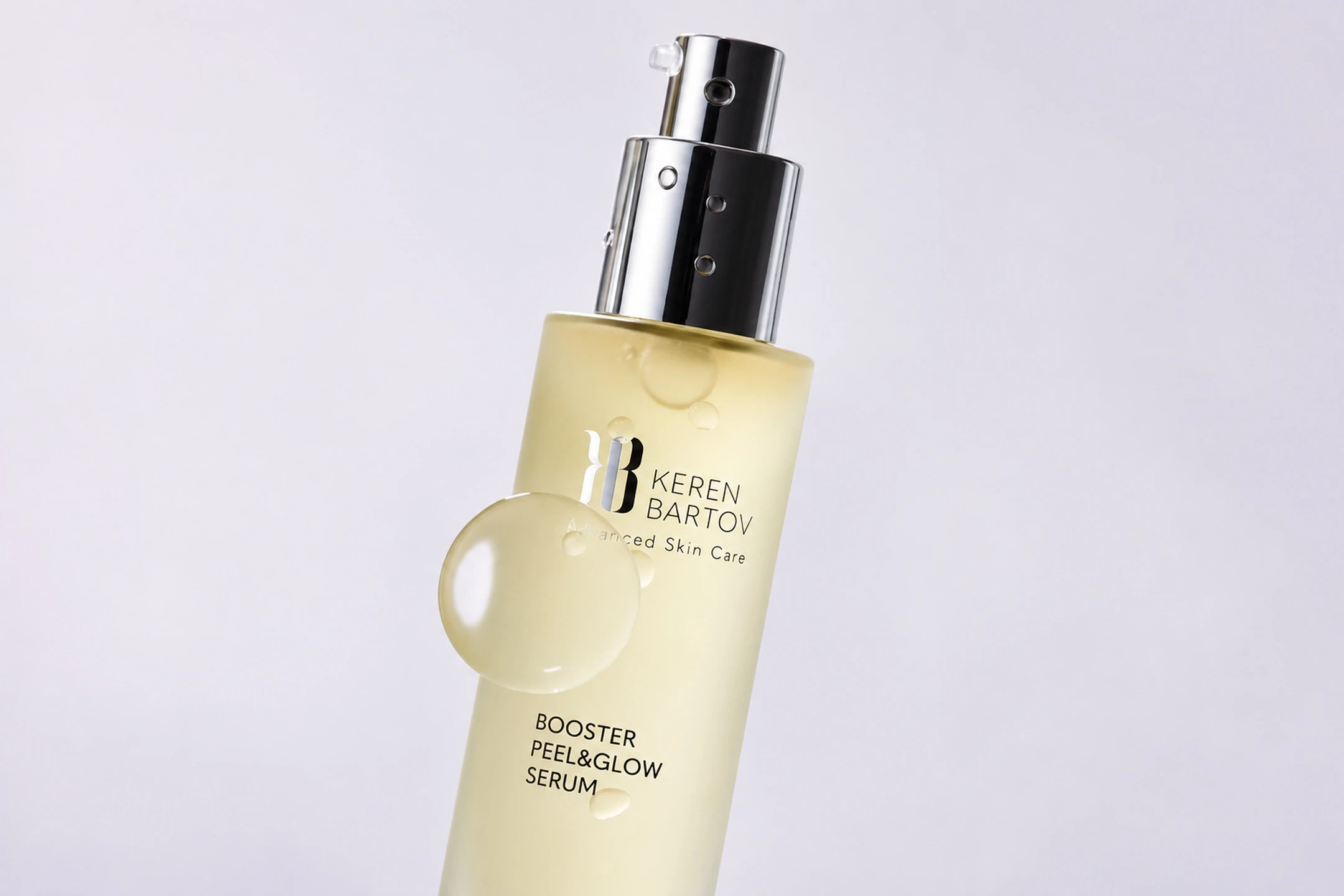 Keren Bartov Booster Peel & Glow Serum in a sleek bottle, promoting radiance and skin renewal with a glossy drop visible.
