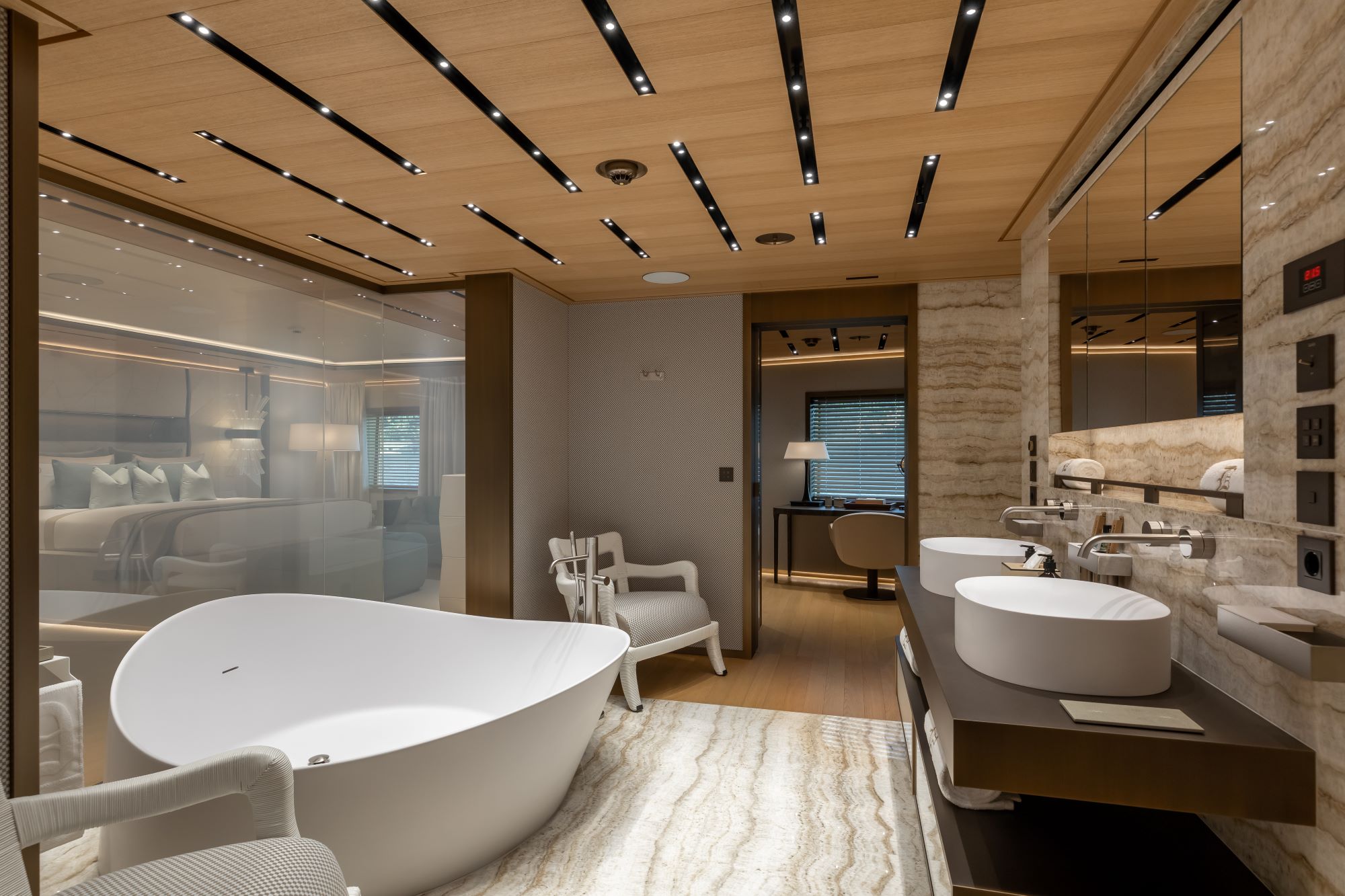 Luxurious bathroom featuring a freestanding bathtub, dual sinks, and stylish decor in a modern yacht setting.