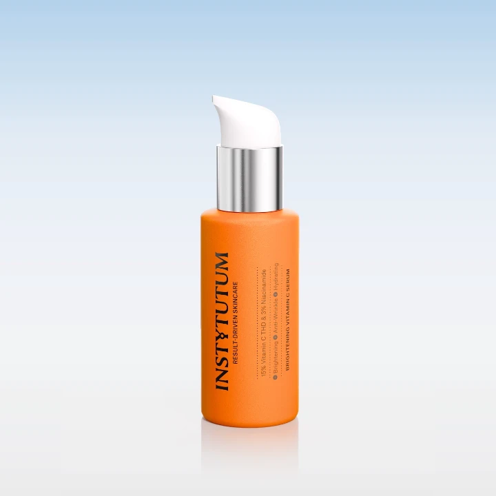 Bright orange skincare serum in a sleek bottle, designed to hydrate and improve skin appearance.