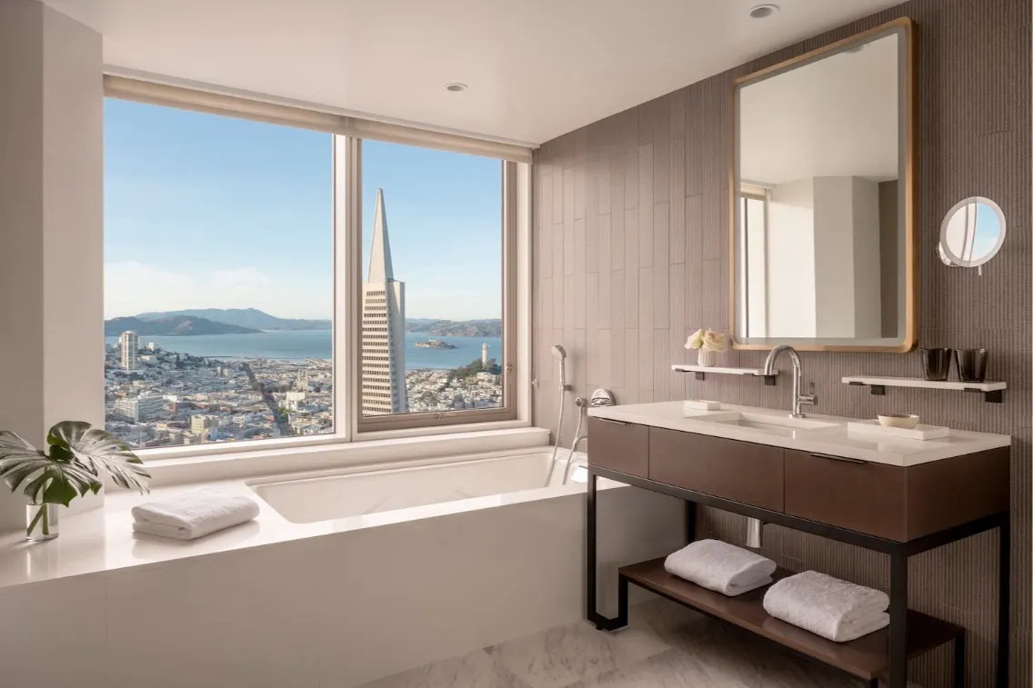 Luxury guestroom bathroom at Four Seasons Hotel San Francisco, featuring a stunning city view and modern amenities.