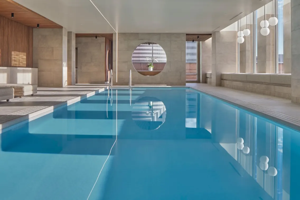 Stylish indoor pool at the St. Regis Hotel in San Francisco, featuring modern design and ample natural light.
