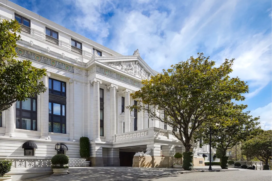 Elegant entrance of The Ritz-Carlton in San Francisco, showcasing classic architecture and landscaped surroundings.