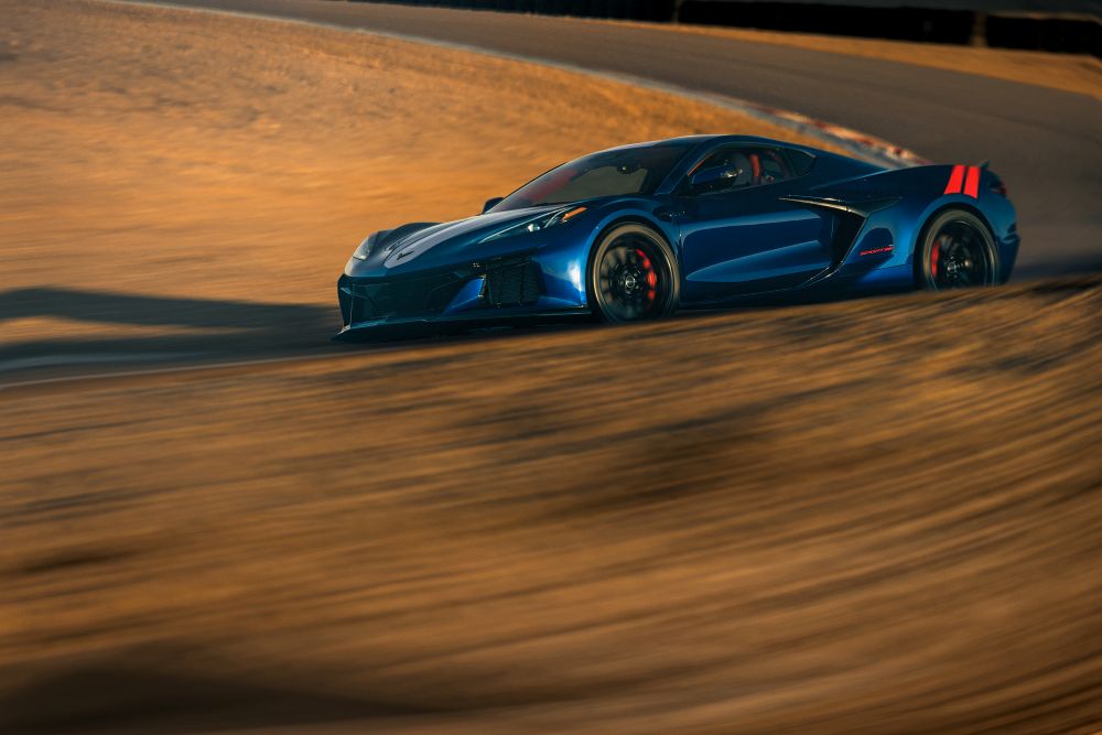 Chevrolet Corvette Grand Sport X in motion on a race track, showcasing its sleek design and performance capabilities.