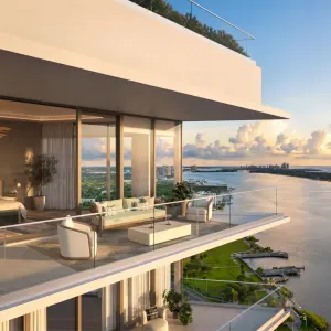 Luxury penthouse terrace overlooking the water, featuring modern furniture and a scenic sunset view in West Palm Beach.