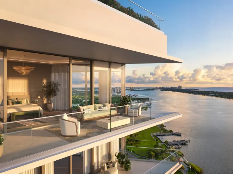 Luxury penthouse terrace overlooking the water, featuring modern furniture and a scenic sunset view in West Palm Beach.