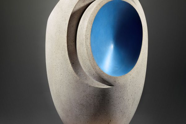 Sculpture by Barbara Hepworth featuring a smooth stone form with a vibrant blue interior section.
