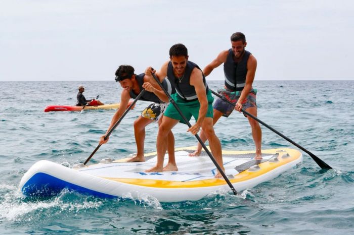 tennis players paddle boarding