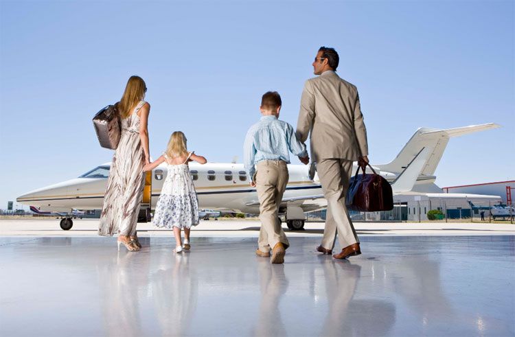 family getting on private jet