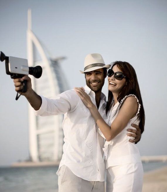 couple standing in front of burj al arab hotel